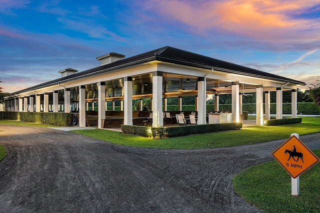 view of outdoor building at dusk