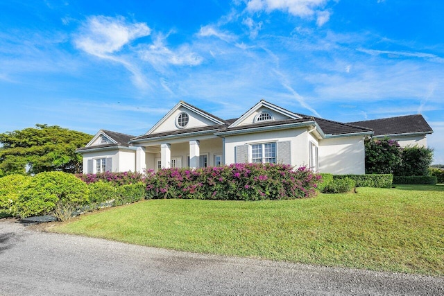 view of front of home with a front yard