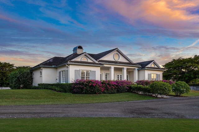 view of front of property with a lawn