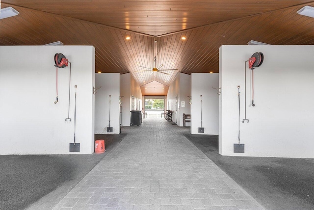 hallway featuring carpet and wood ceiling