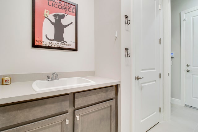 bathroom featuring tile patterned flooring and vanity