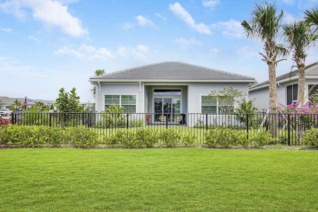 rear view of house with a yard