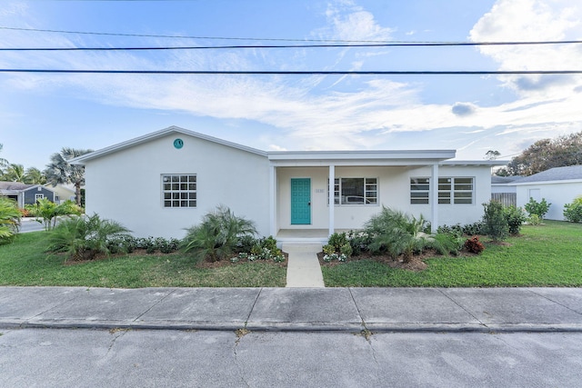 ranch-style house with a front lawn