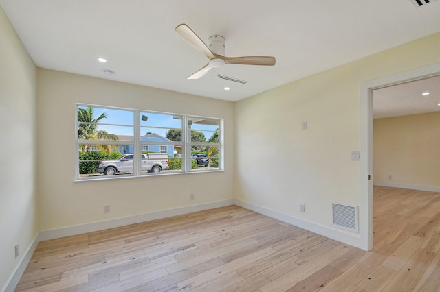 unfurnished room featuring light hardwood / wood-style flooring and ceiling fan