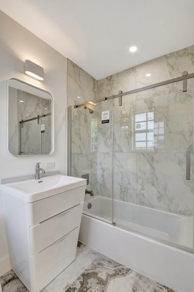 bathroom with shower / bath combination with glass door, vanity, and tile patterned floors