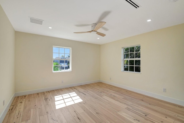 unfurnished room with light hardwood / wood-style flooring and ceiling fan