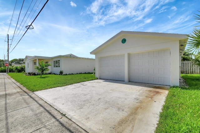 garage featuring a lawn