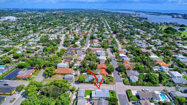 birds eye view of property with a water view