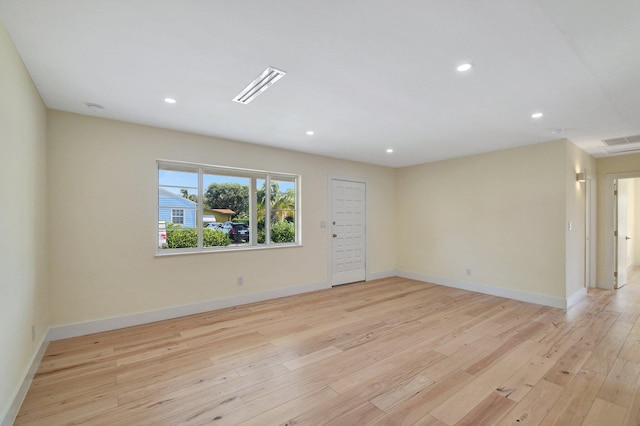 spare room with light hardwood / wood-style flooring