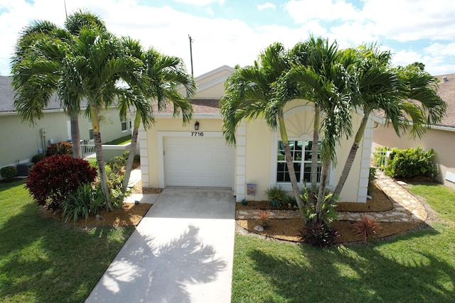 view of front of property featuring a garage and a front yard