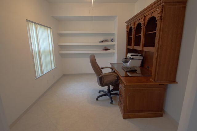 office featuring plenty of natural light and tile patterned floors