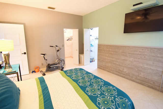 bedroom featuring light tile patterned floors