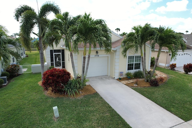 view of front of property featuring a garage and a front yard