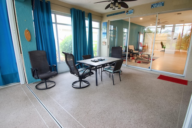 dining area featuring ceiling fan and a wealth of natural light