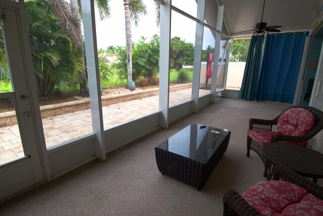 sunroom featuring plenty of natural light and ceiling fan