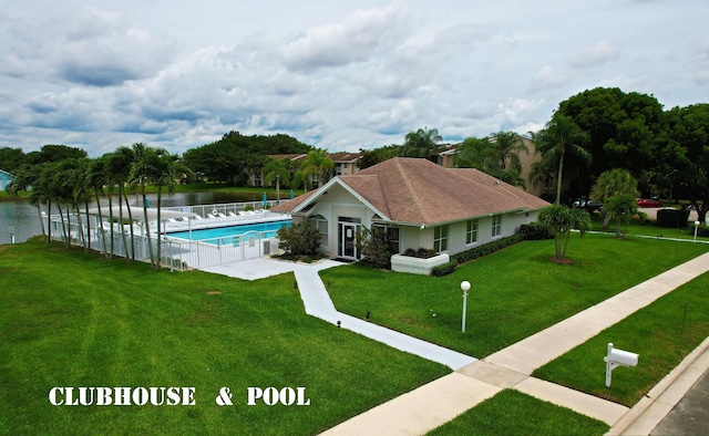 exterior space featuring a water view and a yard