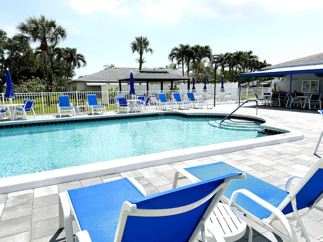 view of swimming pool featuring a patio