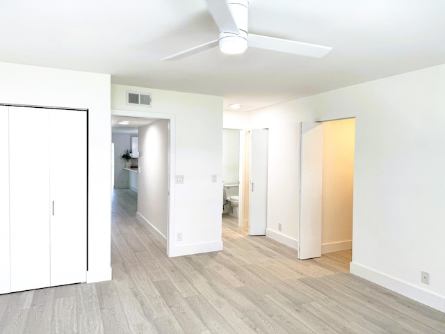 unfurnished bedroom featuring ceiling fan and light wood-type flooring