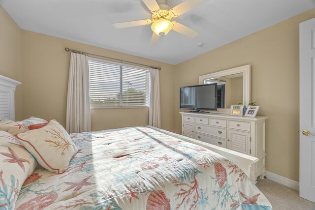 bedroom with ceiling fan and light colored carpet