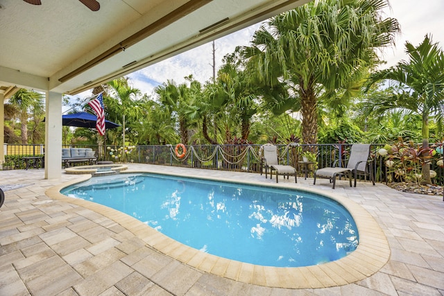 view of pool with an in ground hot tub, ceiling fan, and a patio