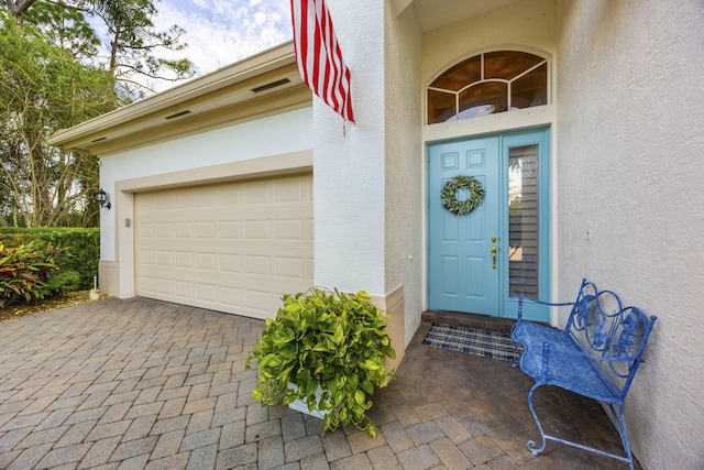 entrance to property featuring a garage