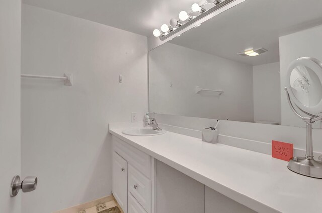 bathroom with tile patterned flooring and vanity