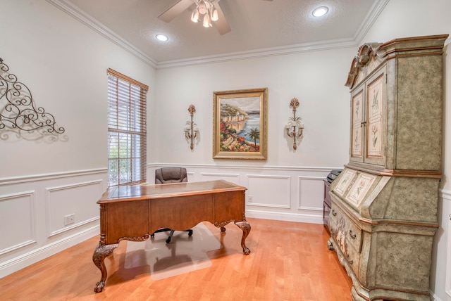 office with ceiling fan, light hardwood / wood-style floors, ornamental molding, and a textured ceiling