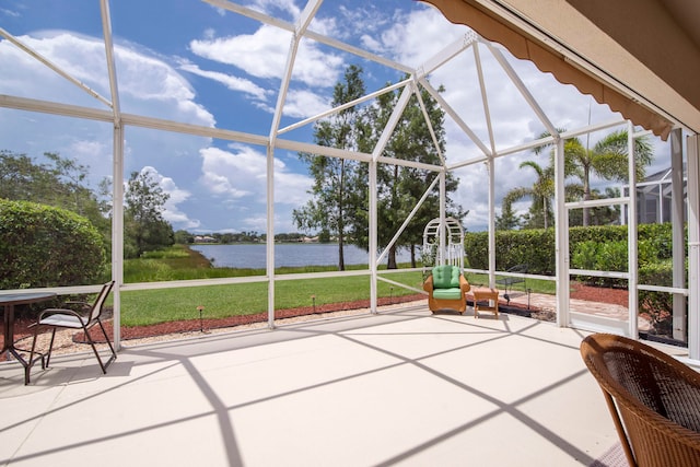 unfurnished sunroom with a water view