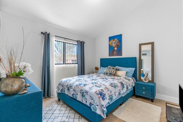 tiled bedroom with vaulted ceiling