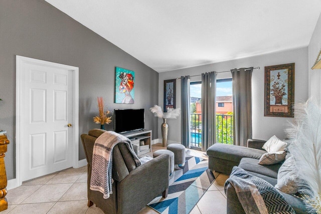 tiled living room featuring lofted ceiling