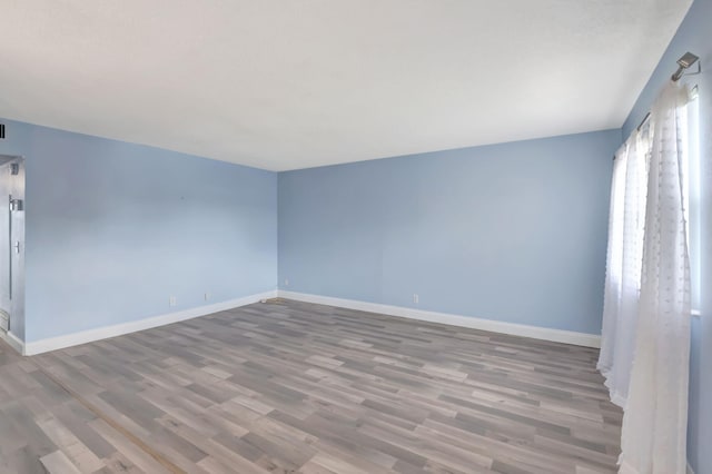 empty room with light wood-type flooring