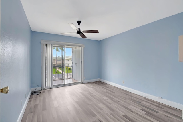 empty room featuring ceiling fan and light hardwood / wood-style floors