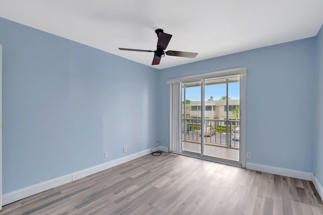 empty room featuring ceiling fan and light hardwood / wood-style flooring