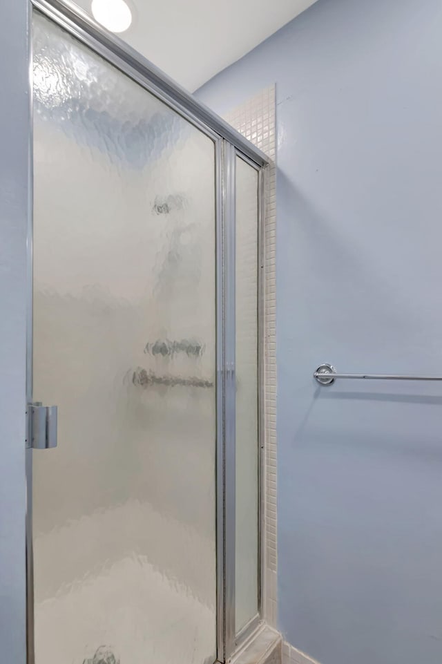 bathroom with an enclosed shower