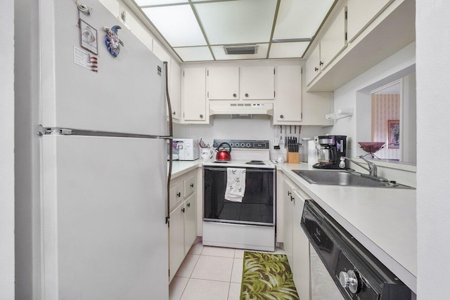 kitchen with custom range hood, white cabinets, light tile patterned floors, sink, and white appliances