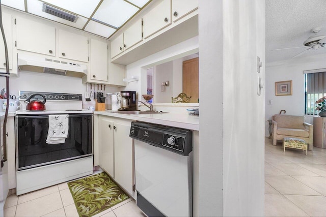 kitchen featuring ceiling fan, dishwasher, light tile patterned floors, white electric range, and white cabinets