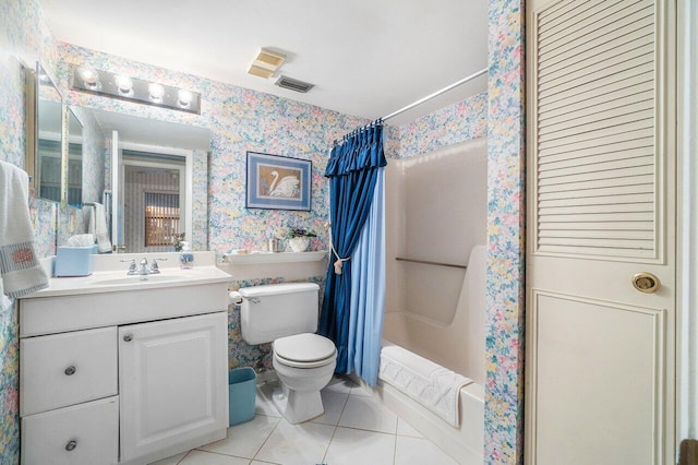 full bathroom with tile patterned floors, vanity, shower / tub combo with curtain, and toilet