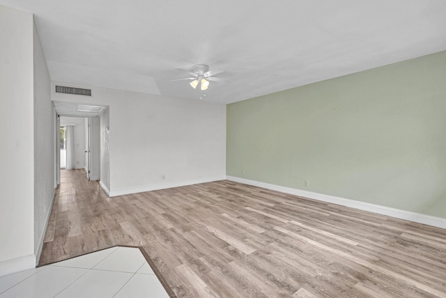 unfurnished room with light hardwood / wood-style flooring and ceiling fan