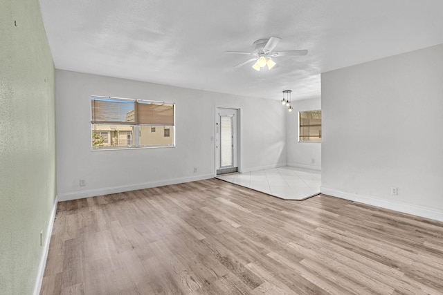 unfurnished room featuring ceiling fan and light wood-type flooring