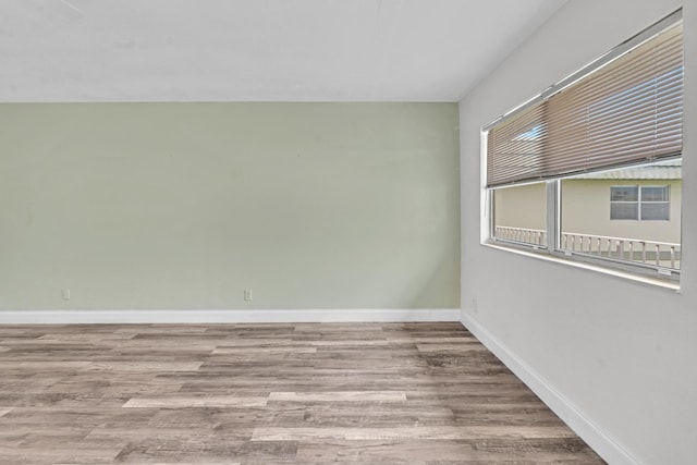 unfurnished room with light hardwood / wood-style floors