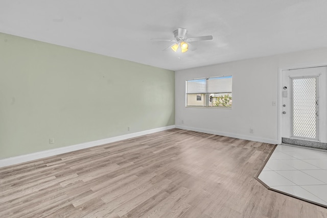 interior space with ceiling fan and light hardwood / wood-style floors