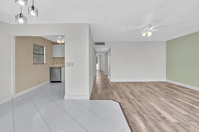 unfurnished living room with light hardwood / wood-style flooring and ceiling fan