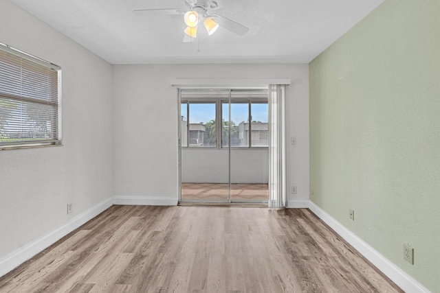 unfurnished room featuring ceiling fan and light wood-type flooring