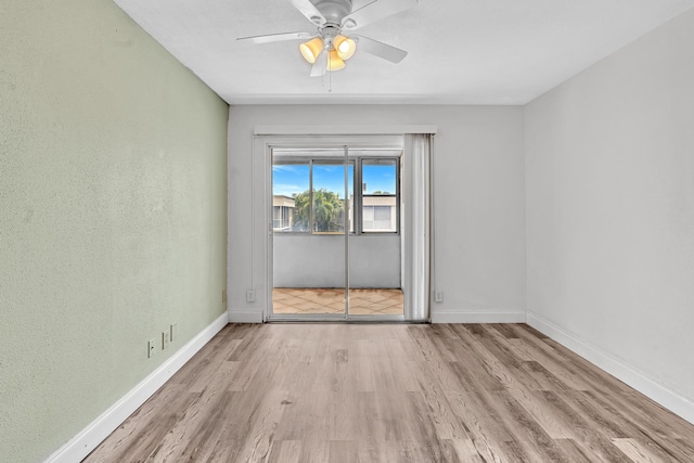 unfurnished room featuring ceiling fan and light hardwood / wood-style floors