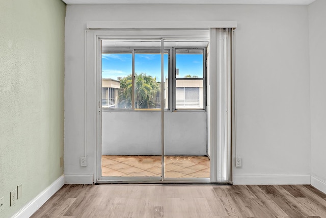 doorway to outside featuring light hardwood / wood-style floors