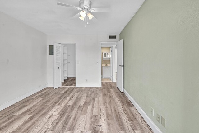 unfurnished bedroom featuring light wood-type flooring and ceiling fan