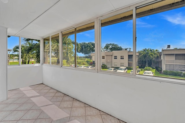 unfurnished sunroom with plenty of natural light