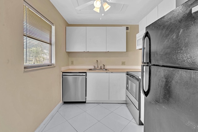 kitchen featuring white cabinets, appliances with stainless steel finishes, sink, and ceiling fan