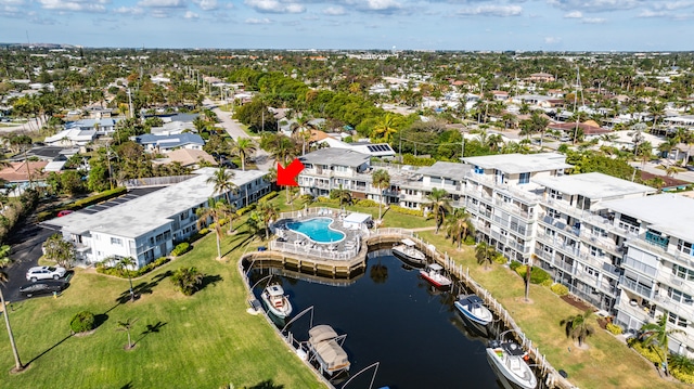 birds eye view of property with a water view