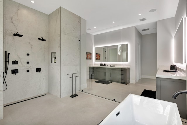 bathroom with vanity and separate shower and tub